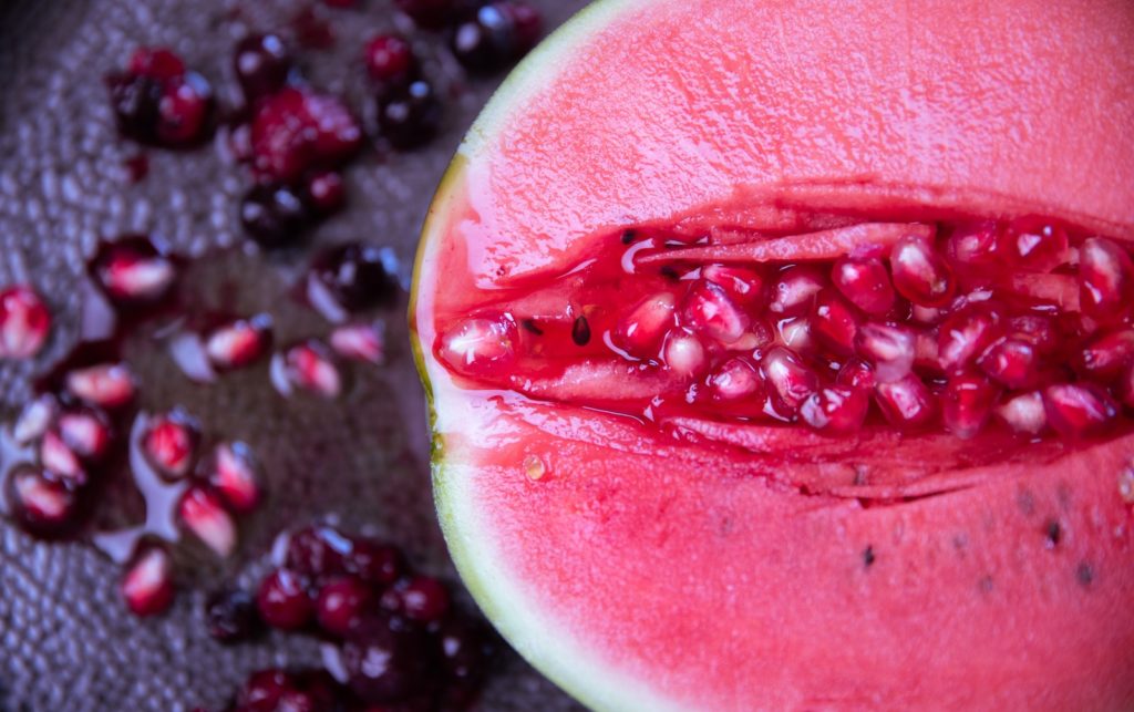 A red sliced watermelon in close up photography. Photo by Maria Talks